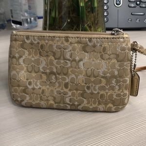 NWOT Coach wristlet in excellent condition. L6” x H4”